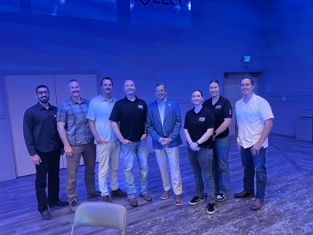 Matt Basgall standing with CPOA members at the Mayor’s Breakfast.